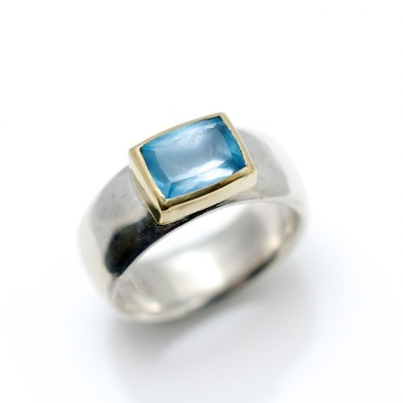 Wide silver ring with rectangular Aquamarine set in 18ct yellow gold