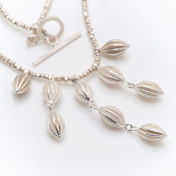 Pod waterfall necklace with silver beads