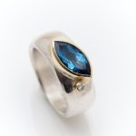 Wide silver ring with Topaz and diamond