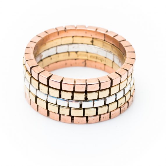 three coloured gold and silver cube rings