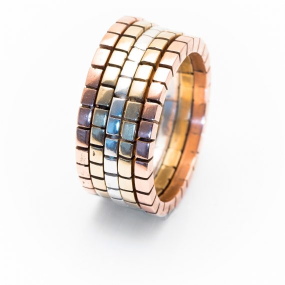 three coloured gold and silver cube rings