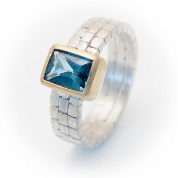 silver and gold cube ring with Topaz