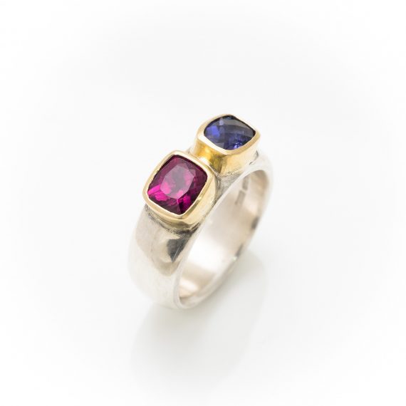Wide silver ring with Iolite and Garnet with 18ct gold settings