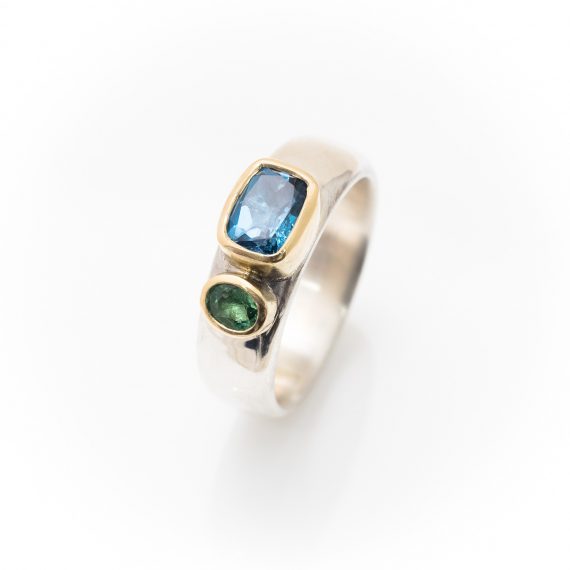 Wide silver ring with Topaz and Tsavorite garnet set in 18ct yellow gold