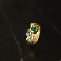 emerald sapphire and diamond scattered gold ring