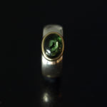 chunky silver and gold ring with green cabuchon tourmaline