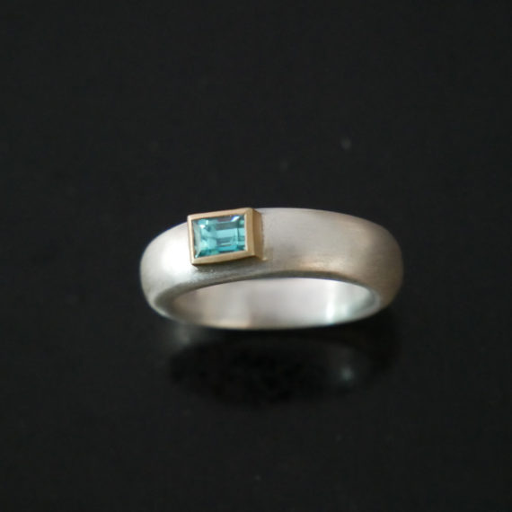 silver, gold and zircon ring