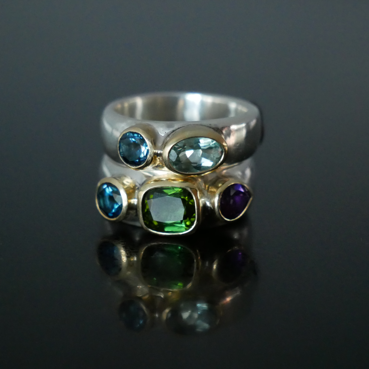 wide silver and gold rings with topaz, tourmaline and aquamarine