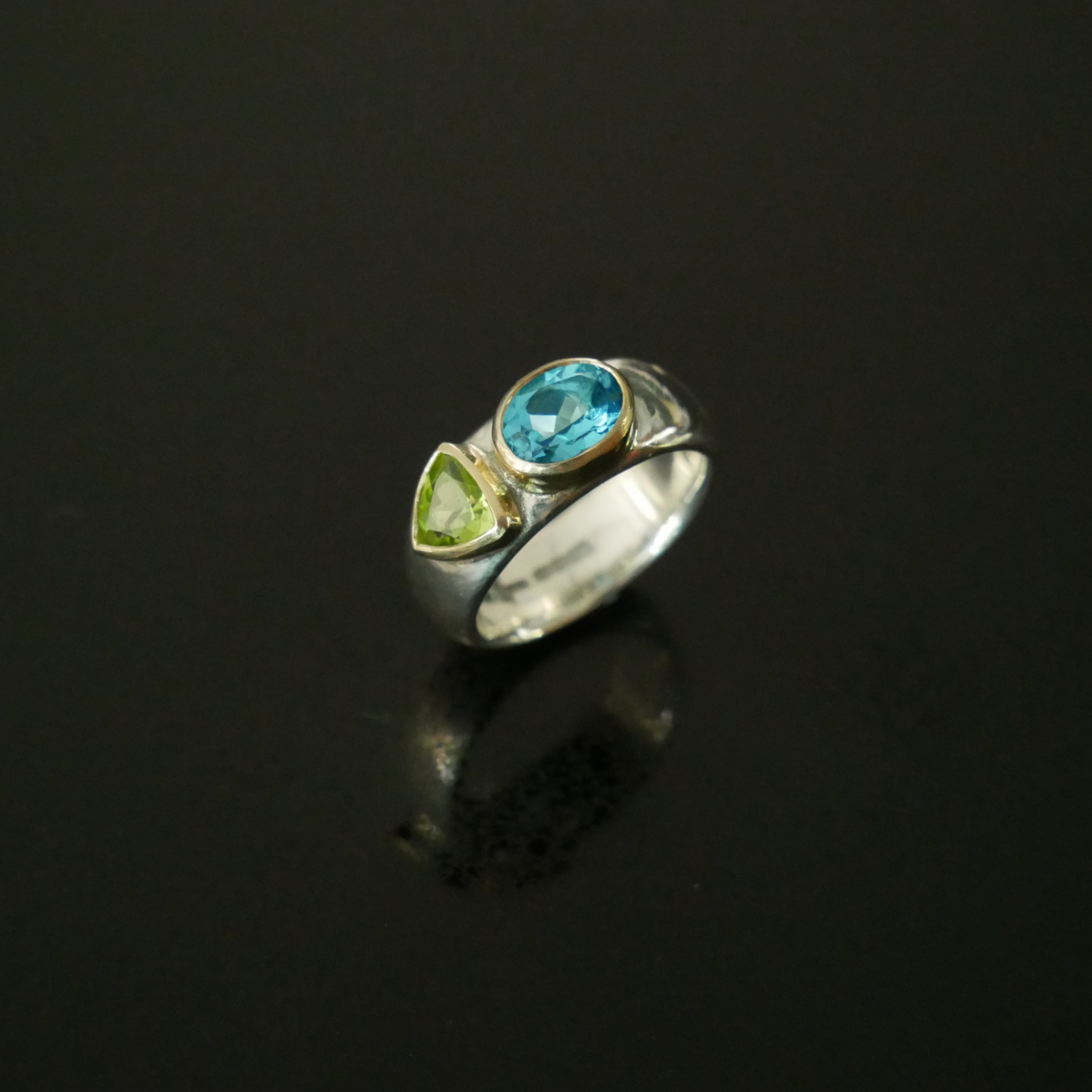 Silver and gold wide ring with topaz and peridot