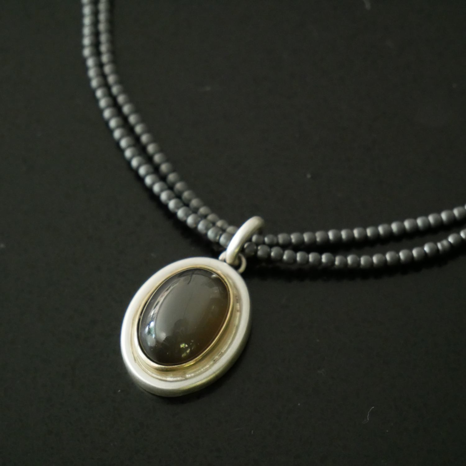 Black moonstone pendant on hematite beads