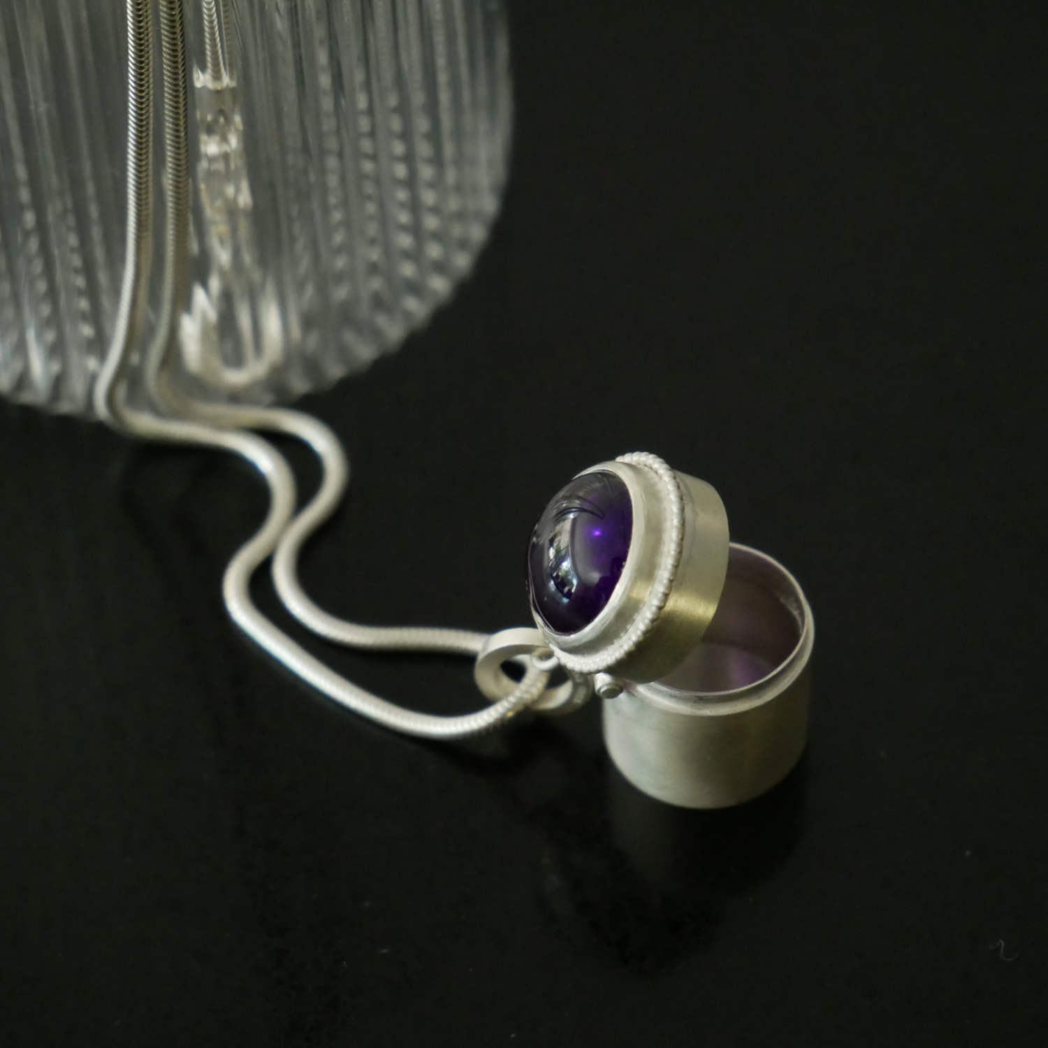 silver box pendant with cabuchon amethyst