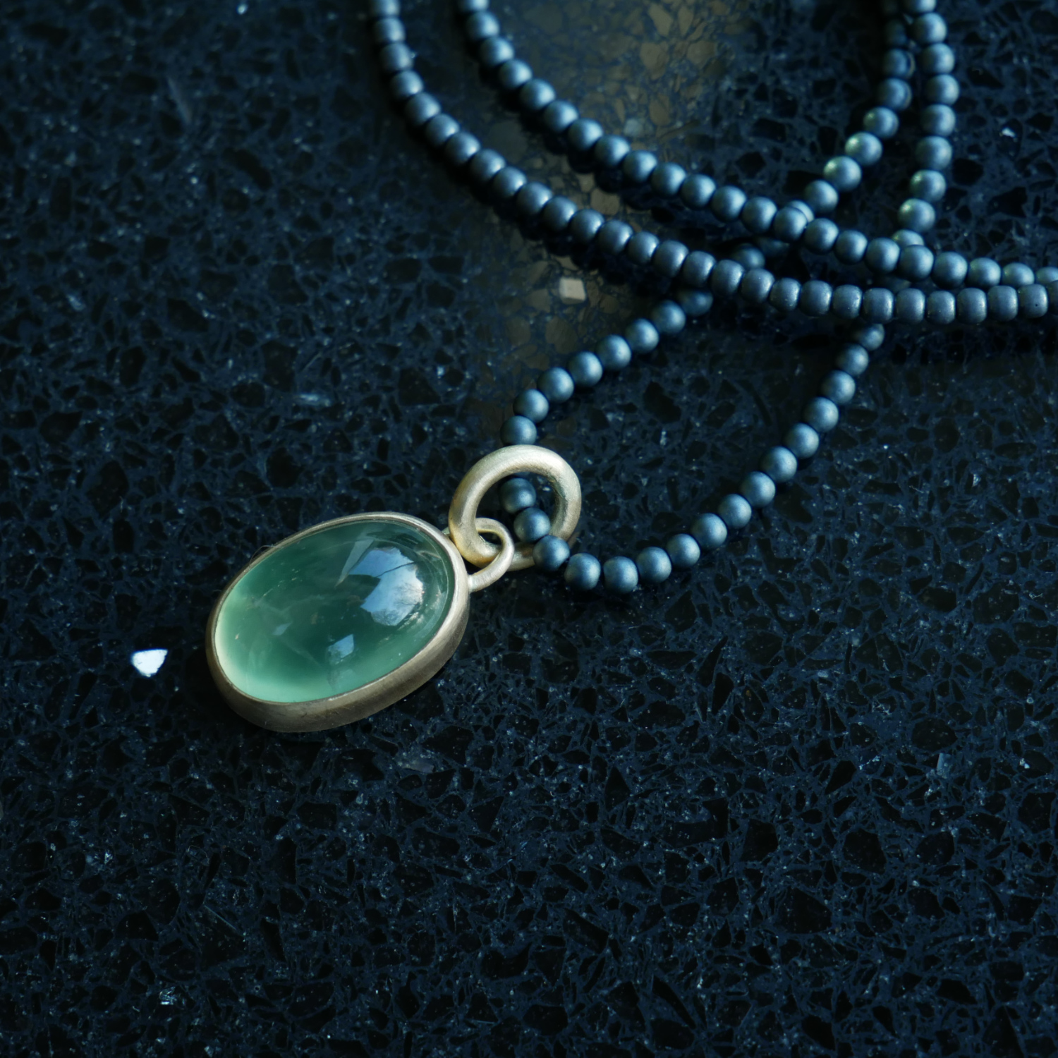 18ct gold prehnite oval pendant on haematite beads